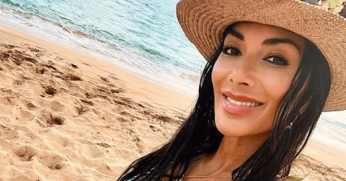 A pink and purple three-piece outfit made Nicole Scherzinger looks colourful when she strolled around the island soaking up the sun