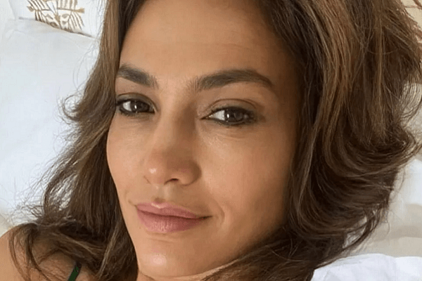 In a very plunging swimsuit while day drinking at LA mansion, Jennifer Lopez showed off her toned and trim body