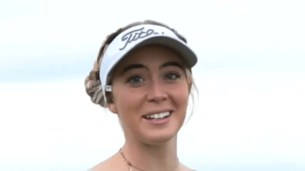 Grace Charis revealing her impressive skills as she wearing a braless crop top and white pants on the golf course