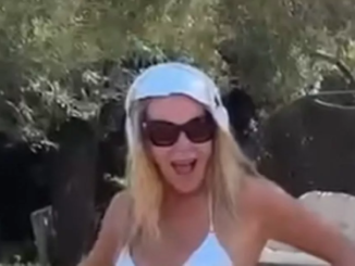 Amanda Holden  flashes a tiny silver bikini as she laughs and confesses, “I’ve lost my mind.”